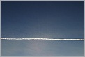 Rayons du Soleil filtrant au travers d'une trainée de condensation d'avion (CANON 10D + 24-70 L)